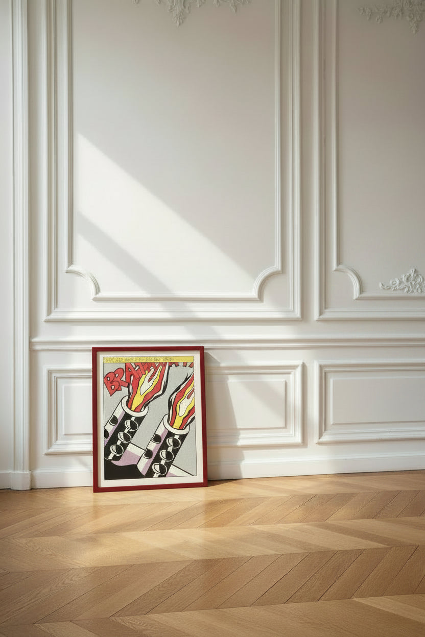 Roy Lichtenstein, As I Opened Fire (1964) poster, shown framed, standing against a white panelled wall on a parquet floor.