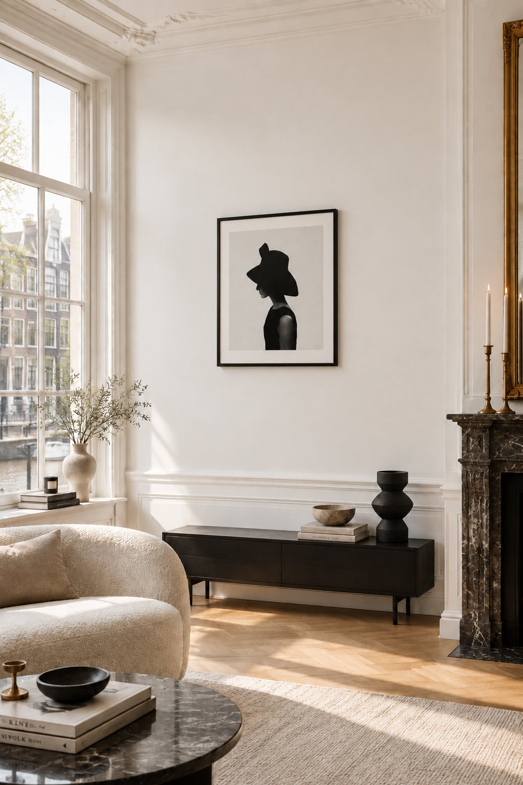 Cecil Beaton, Audrey Hepburn wearing a Givenchy hat, photo art print, shown framed on the wall of a living room with a marble fireplace.