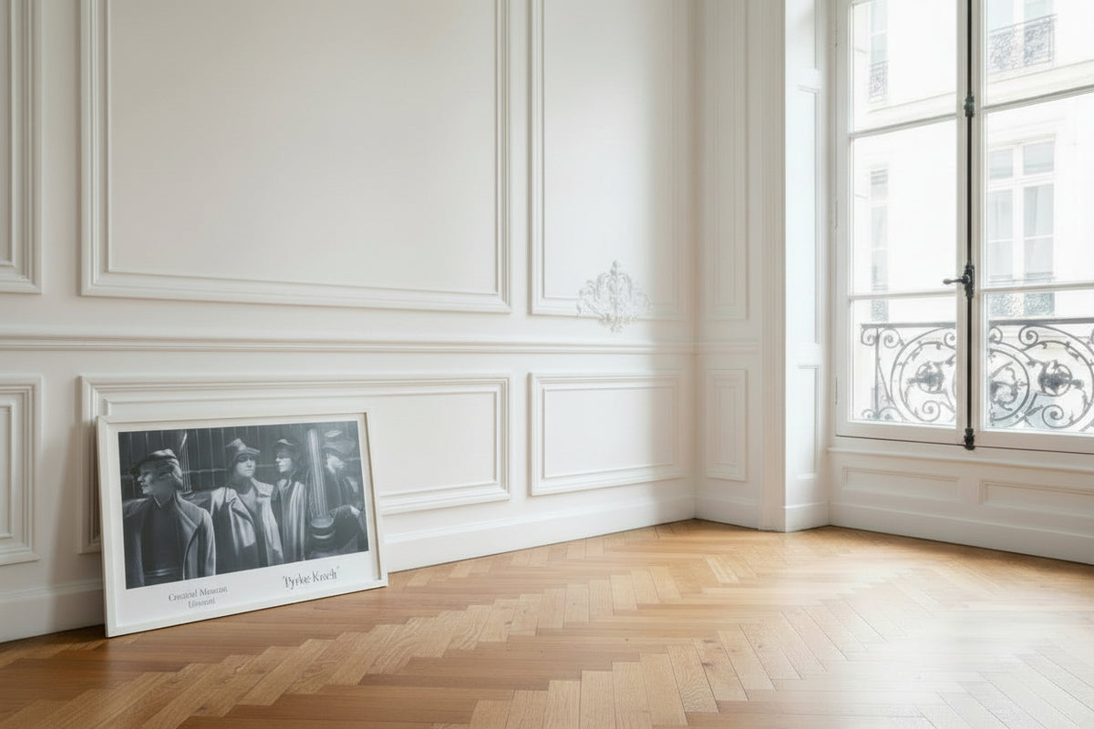 Pyke Koch, Het Wachten (1941) poster, shown framed, leaning against a white panelled wall in an empty room with a parquet floor.