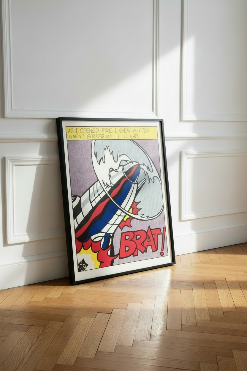 Roy Lichtenstein, As I Opened Fire (1964) poster, shown framed, leaning against a white panelled wall on a parquet floor.